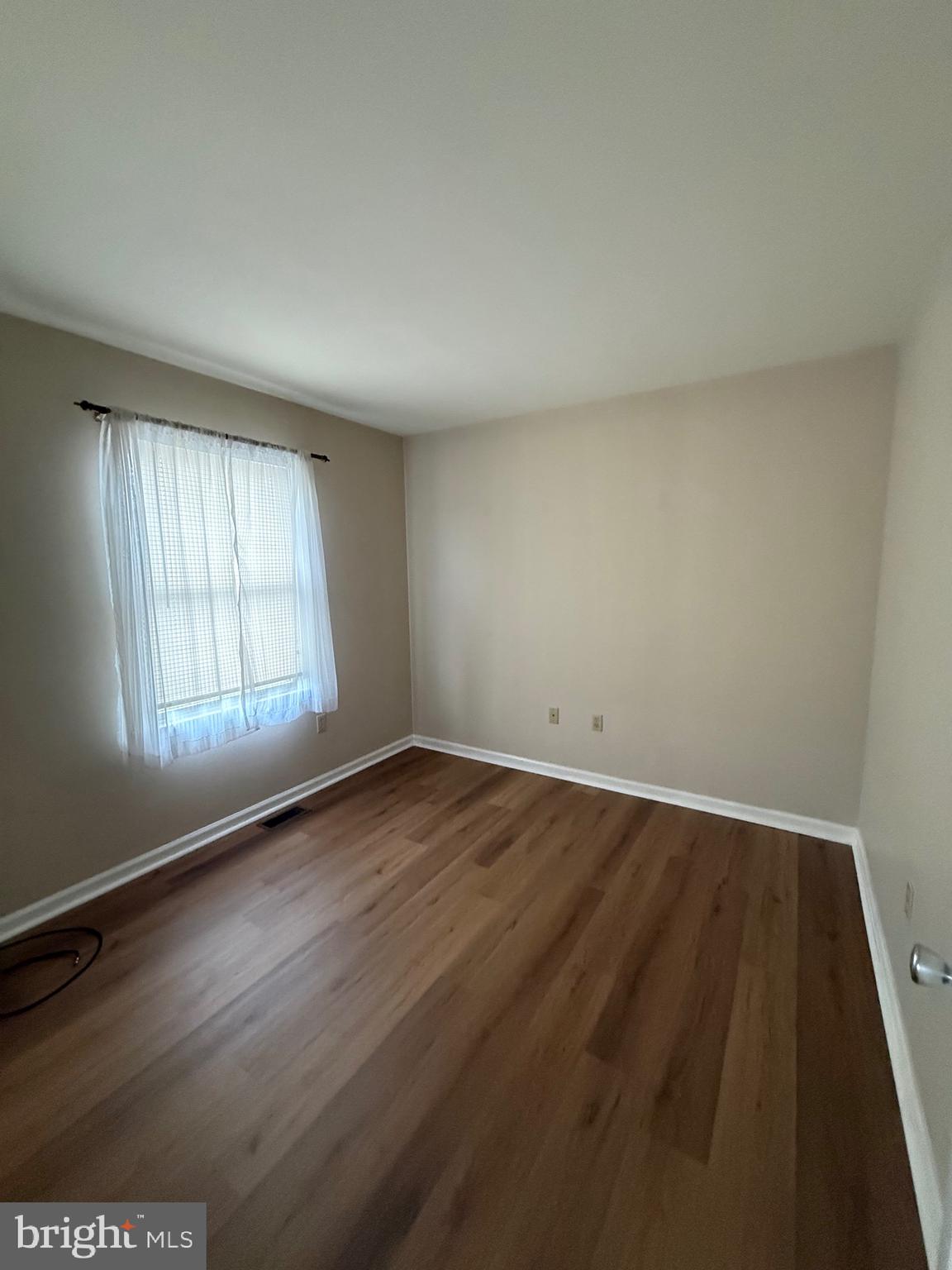 28 Willow Way Drive Enola, PA 17025 - Photo 7 of 22 an empty room with wooden floor and windows
