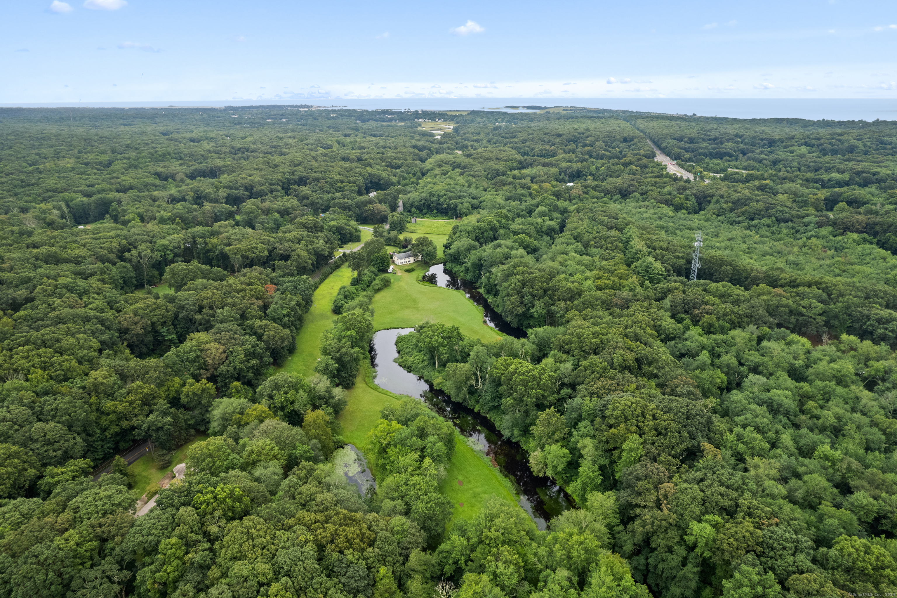 15 River Road Clinton, CT 06413 - Photo 1 of 1 an aerial view of residential houses with outdoor space and trees