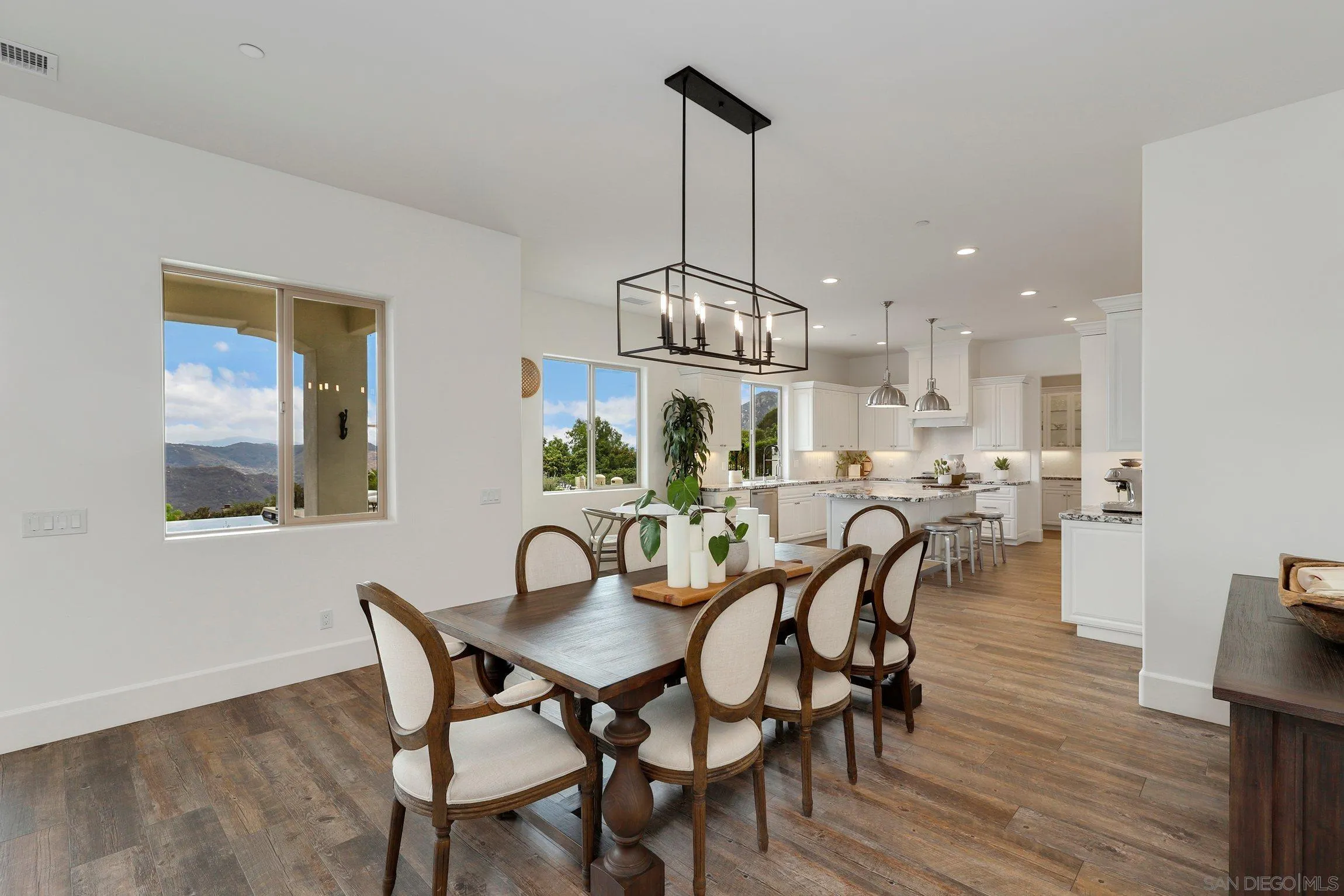 14208 Ridge Oak Place Valley Center, CA 92082 - Photo 22 of 59 a view of a dining room with furniture window and wooden floor