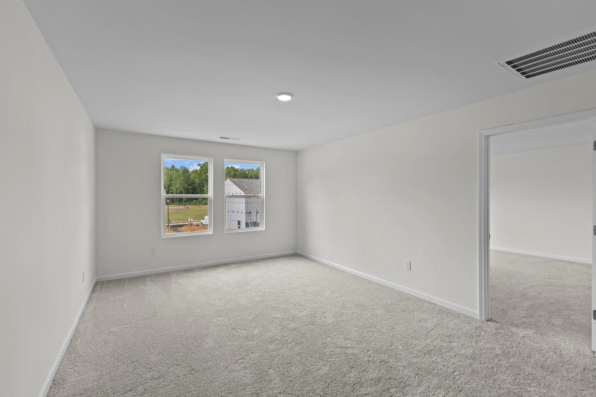 545 Cessna Drive Spring Hope, NC 27882 - Photo 12 of 16 an empty room with windows