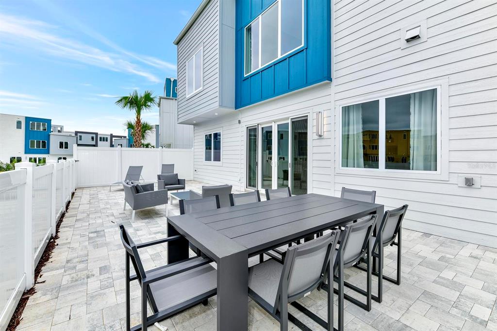 7770 Sandy Ridge Drive, Unit 135 Kissimmee, FL 34747 - Photo 11 of 43 a view of a dinning table and chairs in the patio