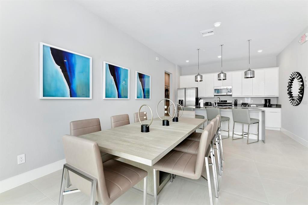 7770 Sandy Ridge Drive, Unit 135 Kissimmee, FL 34747 - Photo 14 of 43 a view of a dining room with furniture