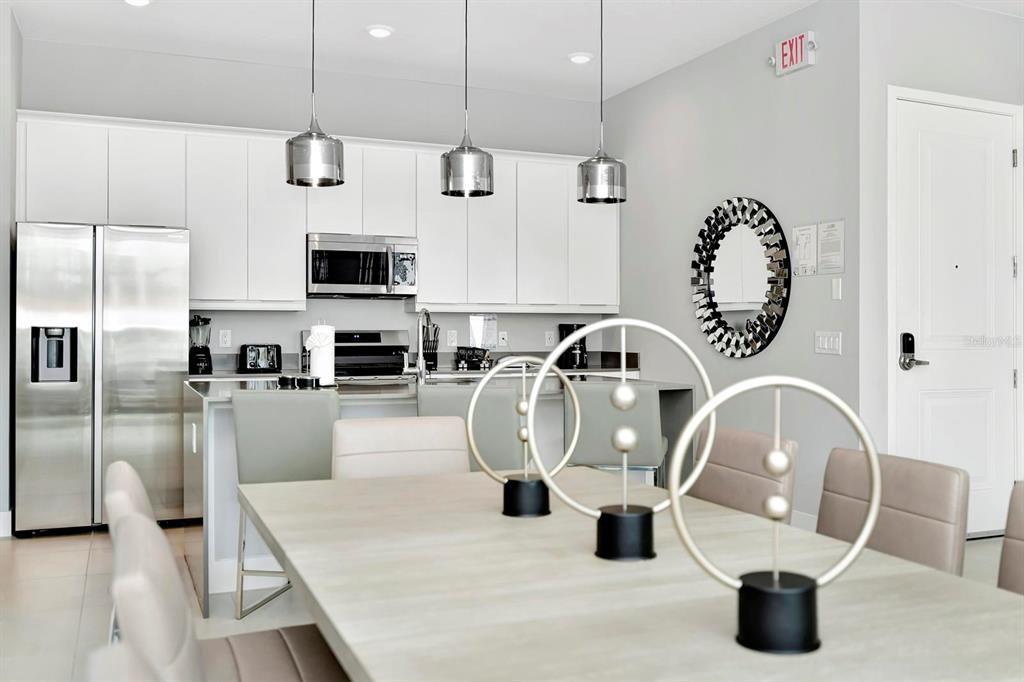 7770 Sandy Ridge Drive, Unit 135 Kissimmee, FL 34747 - Photo 15 of 43 a kitchen with a faucet a stove and a refrigerator