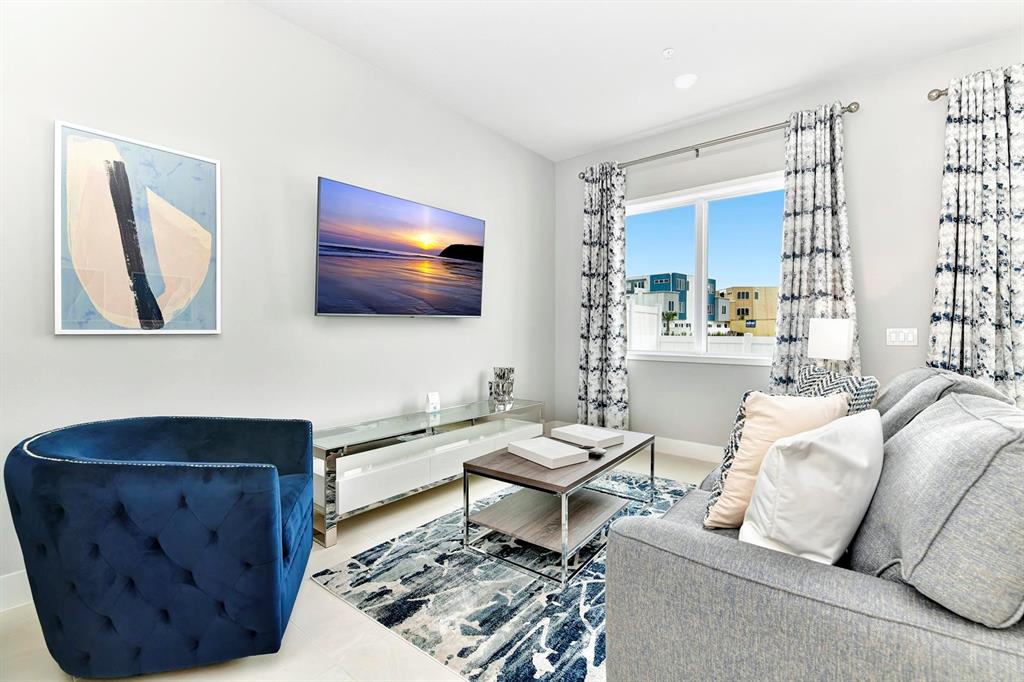 7770 Sandy Ridge Drive, Unit 135 Kissimmee, FL 34747 - Photo 19 of 43 a living room with furniture and a flat screen tv