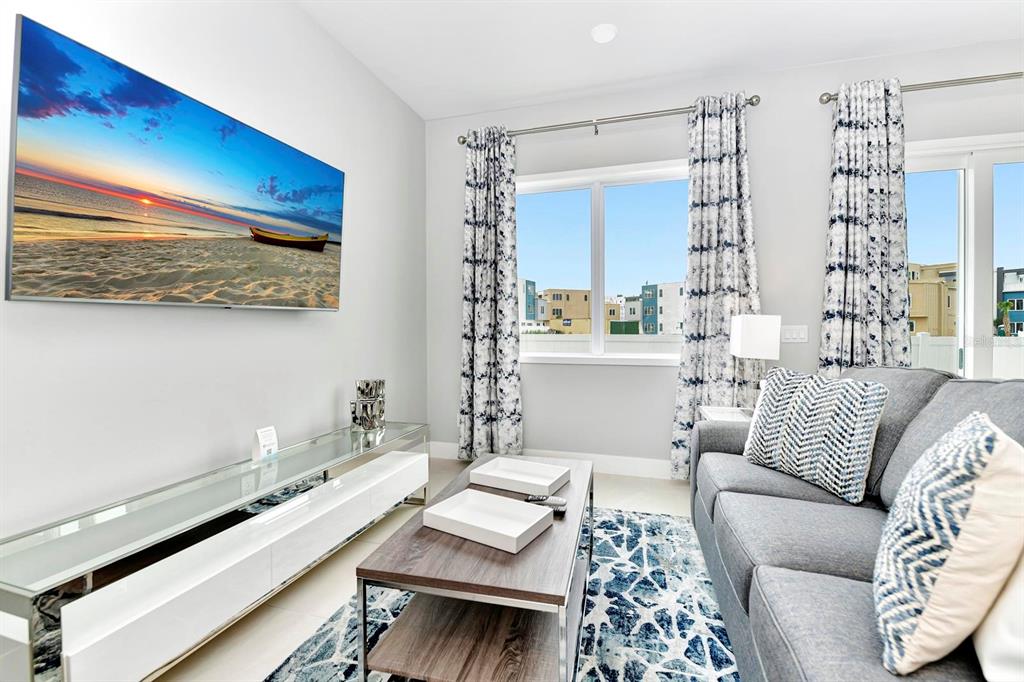 7770 Sandy Ridge Drive, Unit 135 Kissimmee, FL 34747 - Photo 20 of 43 a living room with furniture and a large window