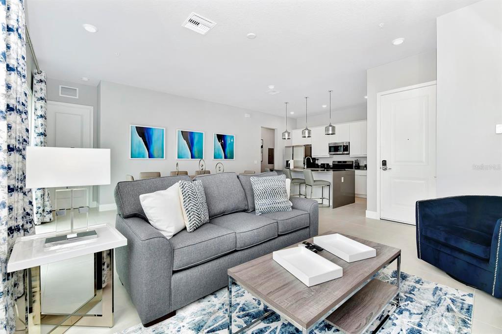 7770 Sandy Ridge Drive, Unit 135 Kissimmee, FL 34747 - Photo 21 of 43 a living room with furniture and kitchen view