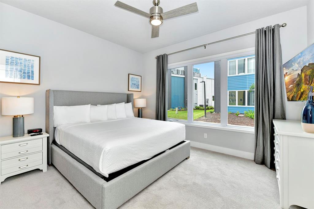 7770 Sandy Ridge Drive, Unit 135 Kissimmee, FL 34747 - Photo 22 of 43 a bed room with a bed and a tv