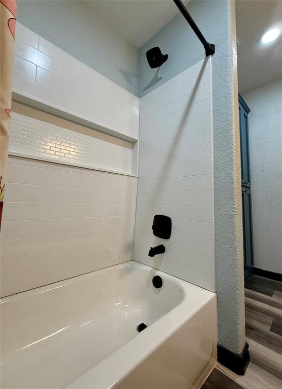 1384 County Road 1235 Point, TX 75472 - Photo 15 of 31 a bathroom with a tub and a shower