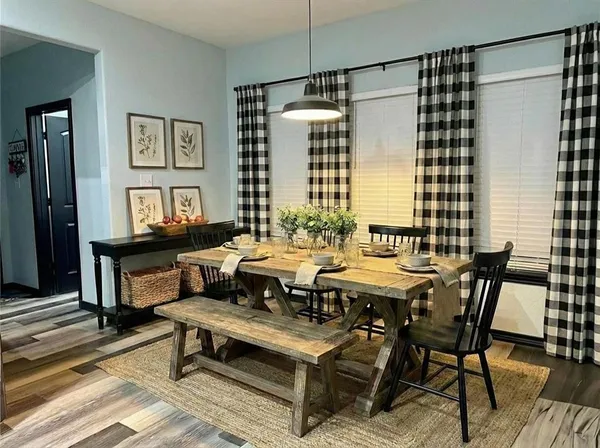 a view of a dining room with furniture