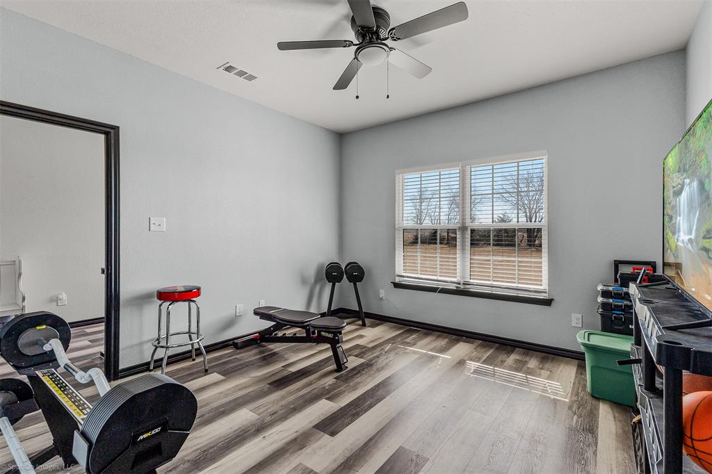 1384 County Road 1235 Point, TX 75472 - Photo 17 of 31 a room with gym equipment and a window