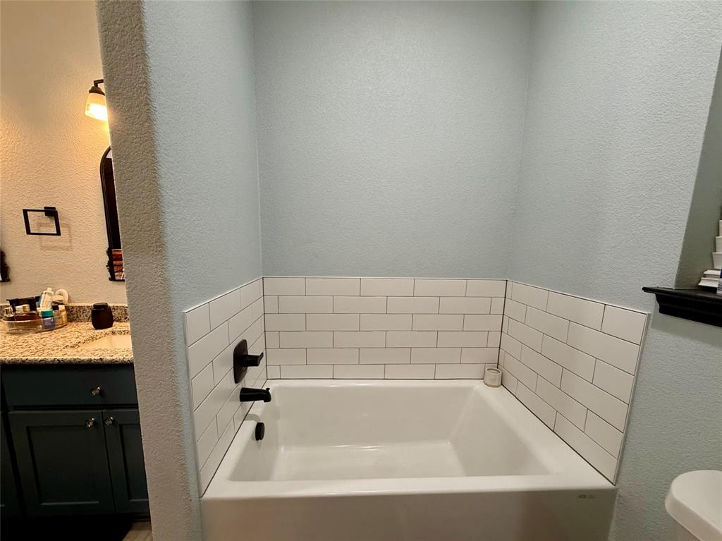 1384 County Road 1235 Point, TX 75472 - Photo 23 of 31 a bathroom with a bathtub and sink