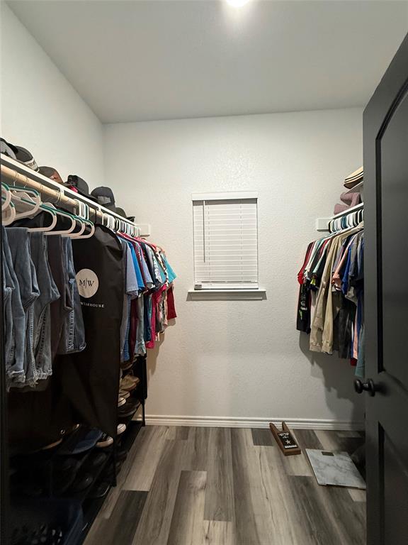 1384 County Road 1235 Point, TX 75472 - Photo 23 of 31 a view of walk in closet with clothes and shoes
