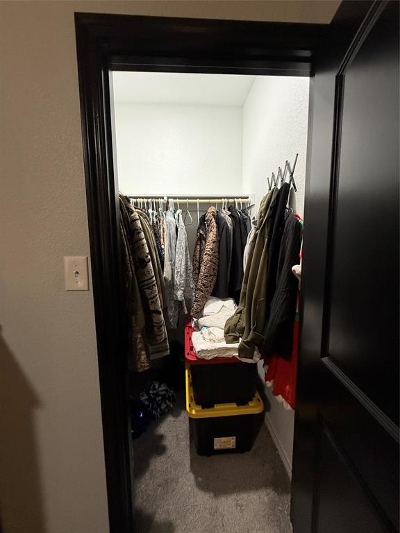 1384 County Road 1235 Point, TX 75472 - Photo 24 of 31 a view of walk in closet with clothes and shoes