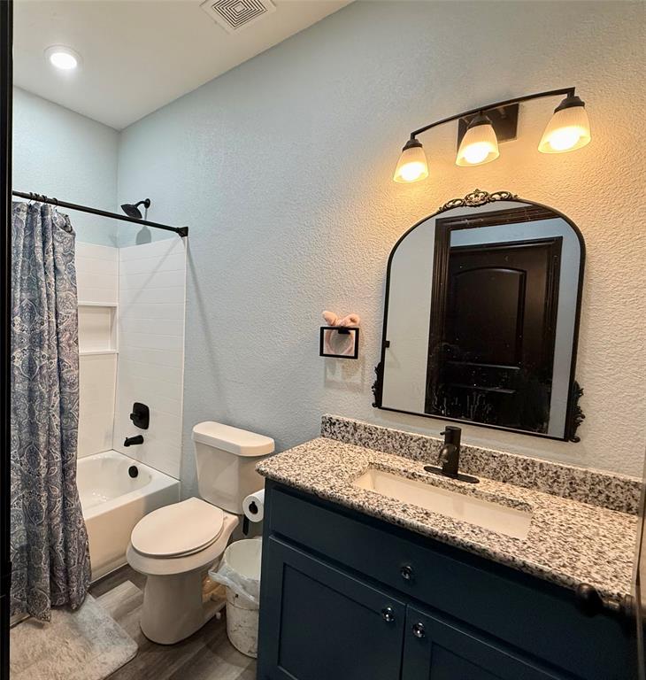 1384 County Road 1235 Point, TX 75472 - Photo 25 of 31 a bathroom with a granite countertop toilet sink and mirror