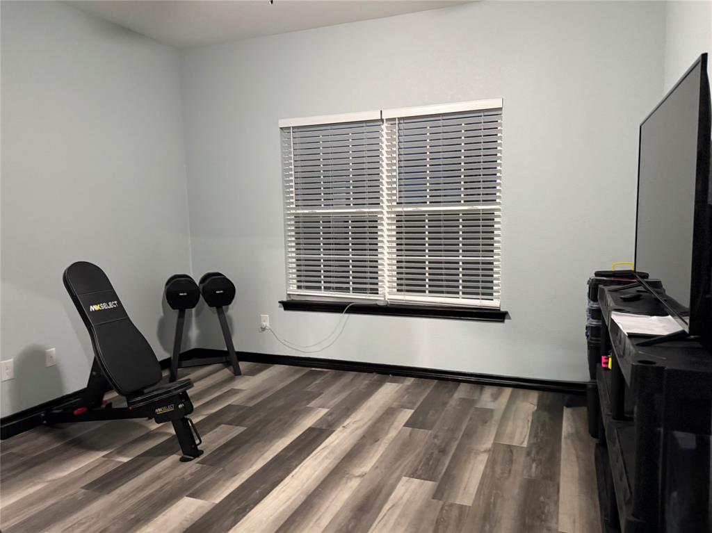 1384 County Road 1235 Point, TX 75472 - Photo 27 of 31 a view of a workspace with furniture and a window