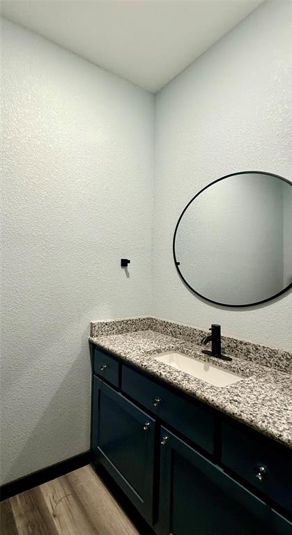 1384 County Road 1235 Point, TX 75472 - Photo 27 of 31 a bathroom with a granite countertop sink and a mirror