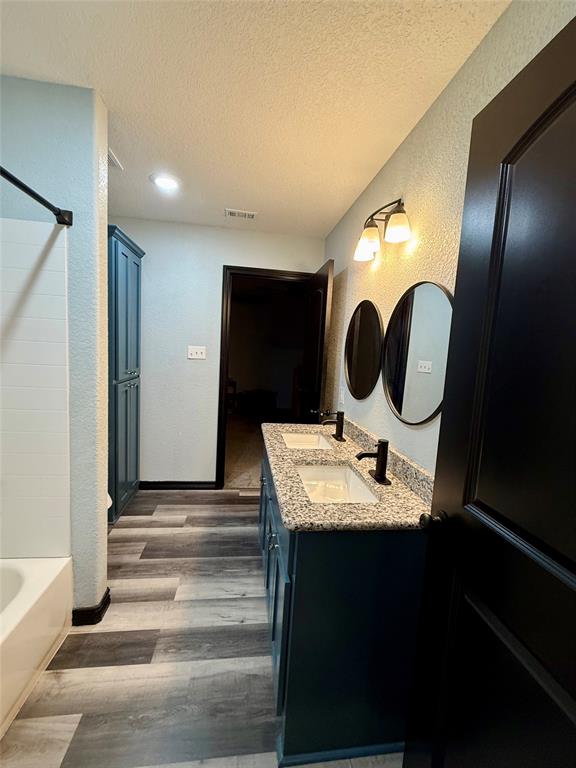 1384 County Road 1235 Point, TX 75472 - Photo 29 of 31 a bathroom with a sink and a mirror