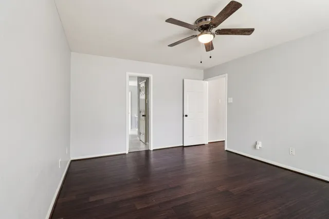 a bathroom with a double vanity sink a mirror and a bathtub