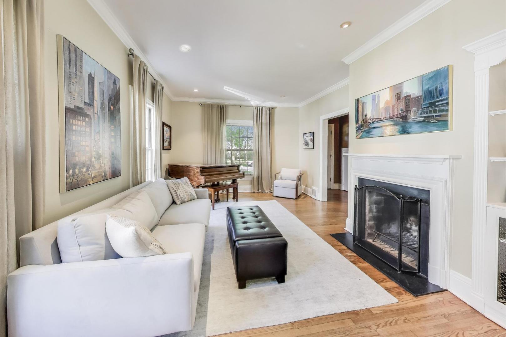 274 Ridge Avenue Winnetka, IL 60093 - Photo 4 of 36 a living room with furniture and a fireplace