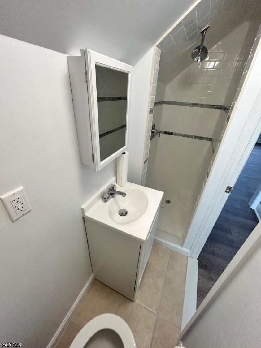 222 Inslee Place, Unit 2 Elizabeth Port, NJ 07206 - Photo 14 of 15 a bathroom with a sink and mirror