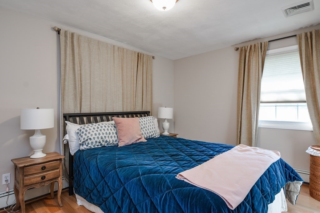 18 Raleigh Road Framingham, MA 01701 - Photo 13 of 18 a bedroom with a bed and a night stand