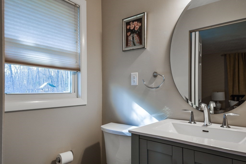 18 Raleigh Road Framingham, MA 01701 - Photo 14 of 18 a bathroom with a sink and a mirror