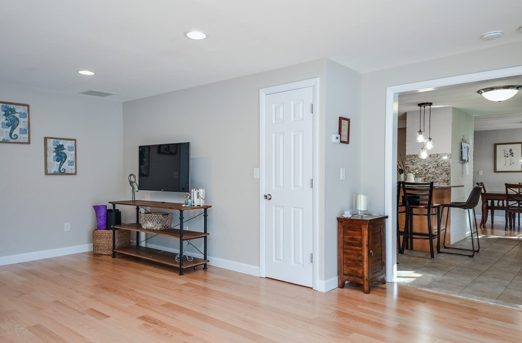 18 Raleigh Road Framingham, MA 01701 - Photo 17 of 18 a view of a livingroom with furniture and a flat screen tv