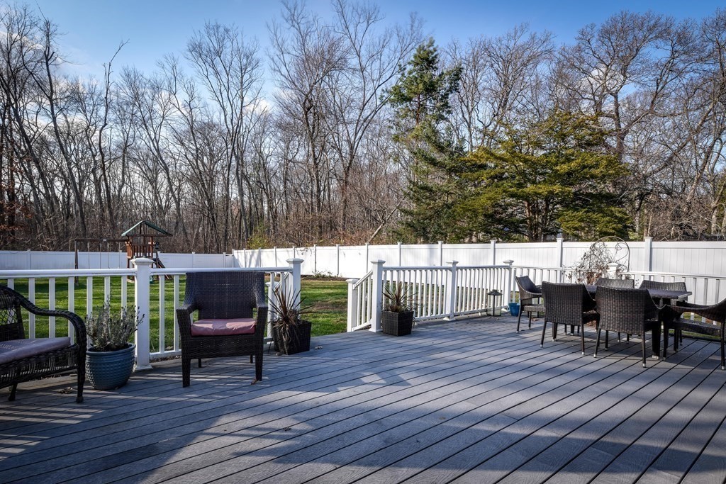 18 Raleigh Road Framingham, MA 01701 - Photo 3 of 18 a view of house with outdoor seating space and wooden floor