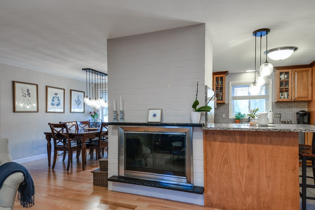 18 Raleigh Road Framingham, MA 01701 - Photo 6 of 18 a kitchen with granite countertop a stove dining table and chairs