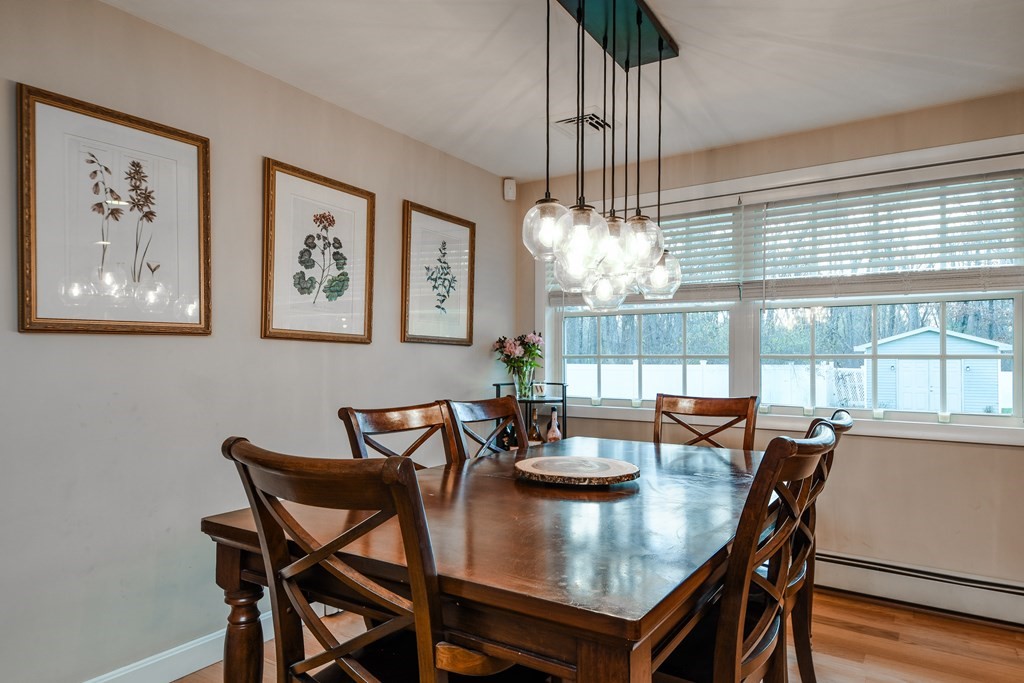 18 Raleigh Road Framingham, MA 01701 - Photo 7 of 18 a view of a dining room with furniture wooden floor and chandelier