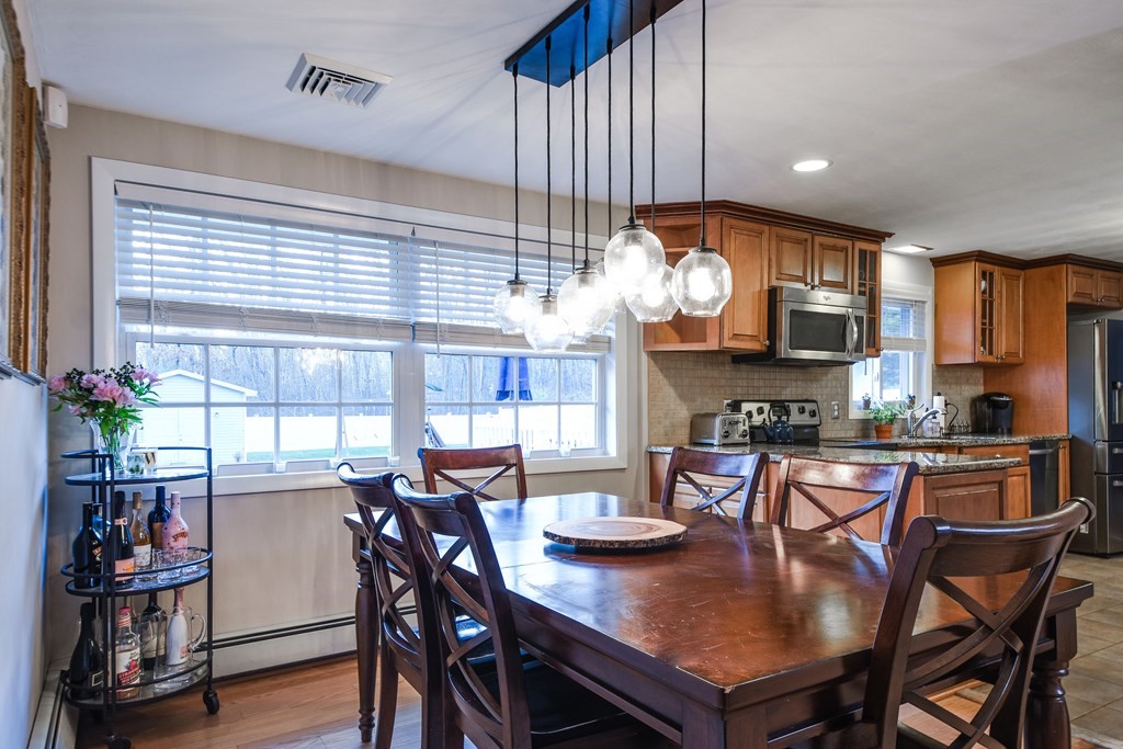 18 Raleigh Road Framingham, MA 01701 - Photo 8 of 18 a view of a dining room with furniture window and wooden floor