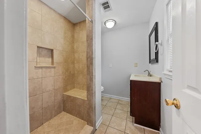 a bathroom with a bathtub and sink