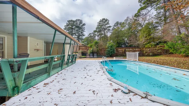 a view of a house with wooden fence