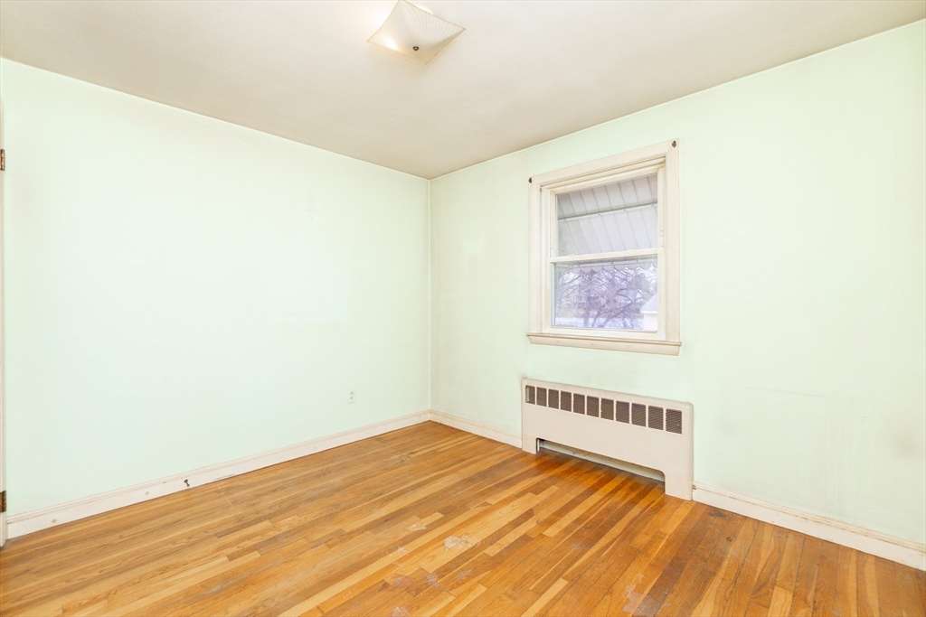 51 Pincushion Road Framingham, MA 01702 - Photo 16 of 42 a view of a room with wooden floor and white walls