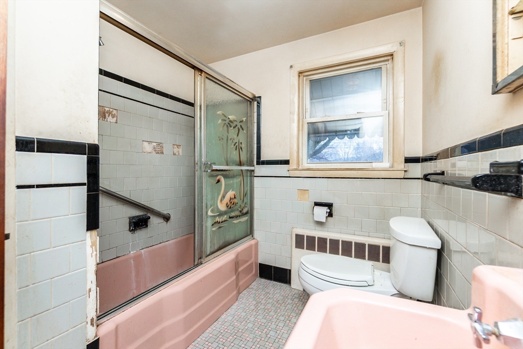 51 Pincushion Road Framingham, MA 01702 - Photo 17 of 42 a bathroom with a toilet a sink and a bathtub
