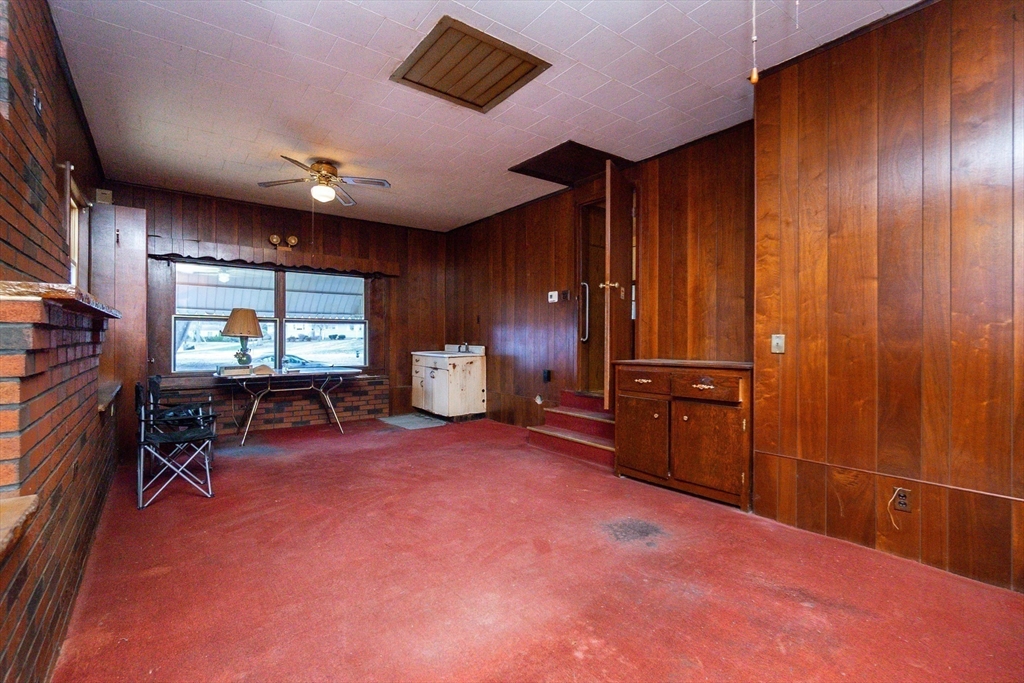 51 Pincushion Road Framingham, MA 01702 - Photo 18 of 42 a view of a livingroom with furniture and a flat screen tv