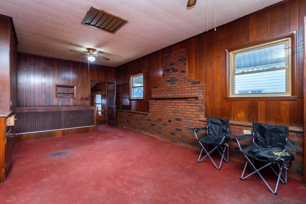 51 Pincushion Road Framingham, MA 01702 - Photo 20 of 42 a view of a livingroom with furniture and a projector