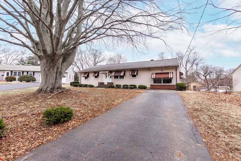 51 Pincushion Road Framingham, MA 01702 - Photo 2 of 42 a view of house with outdoor space and covered with trees