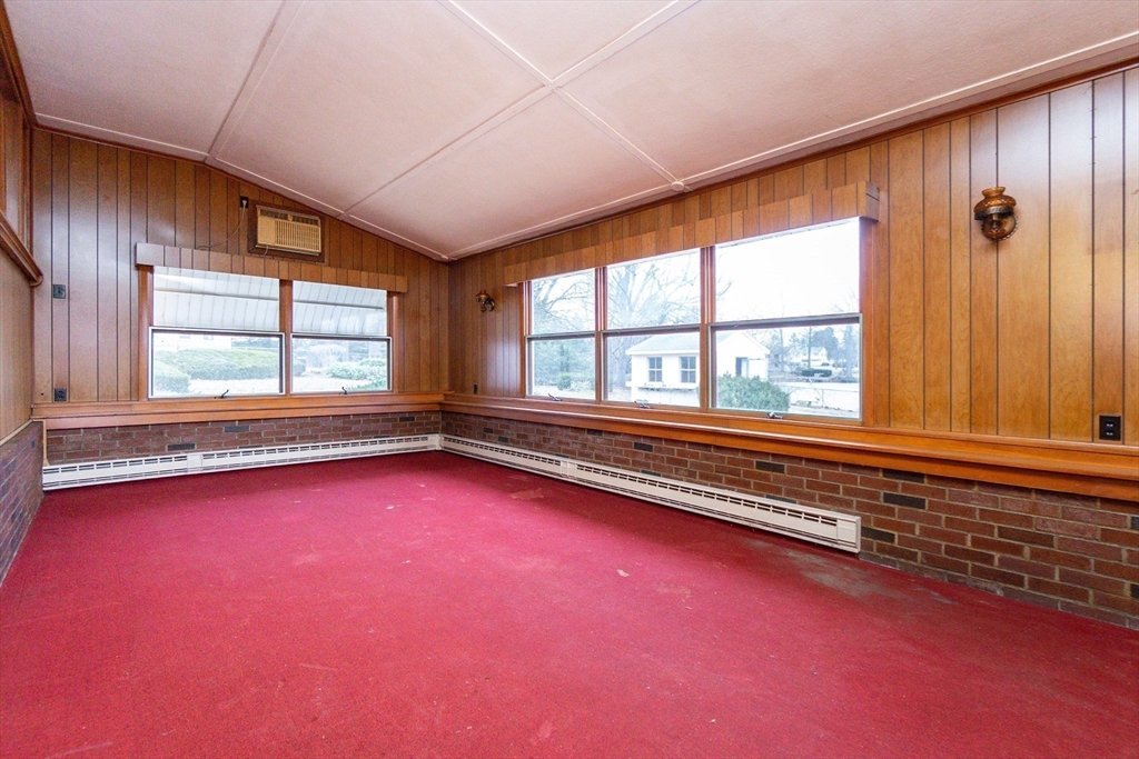 51 Pincushion Road Framingham, MA 01702 - Photo 22 of 42 an empty room with large windows and ceiling fan