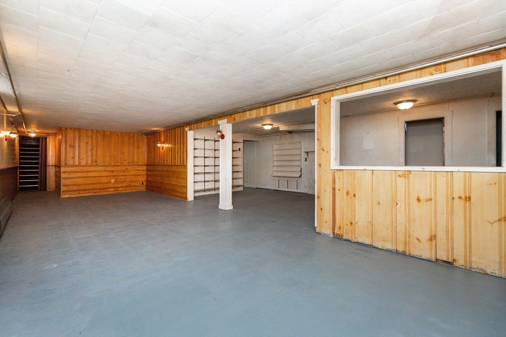 51 Pincushion Road Framingham, MA 01702 - Photo 25 of 42 a view of an empty room with stairs and furniture