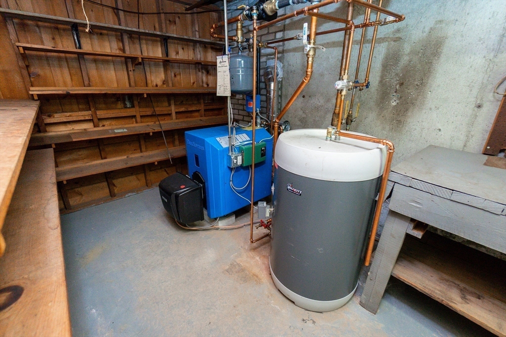 51 Pincushion Road Framingham, MA 01702 - Photo 28 of 42 a bathroom with a sink and a mirror