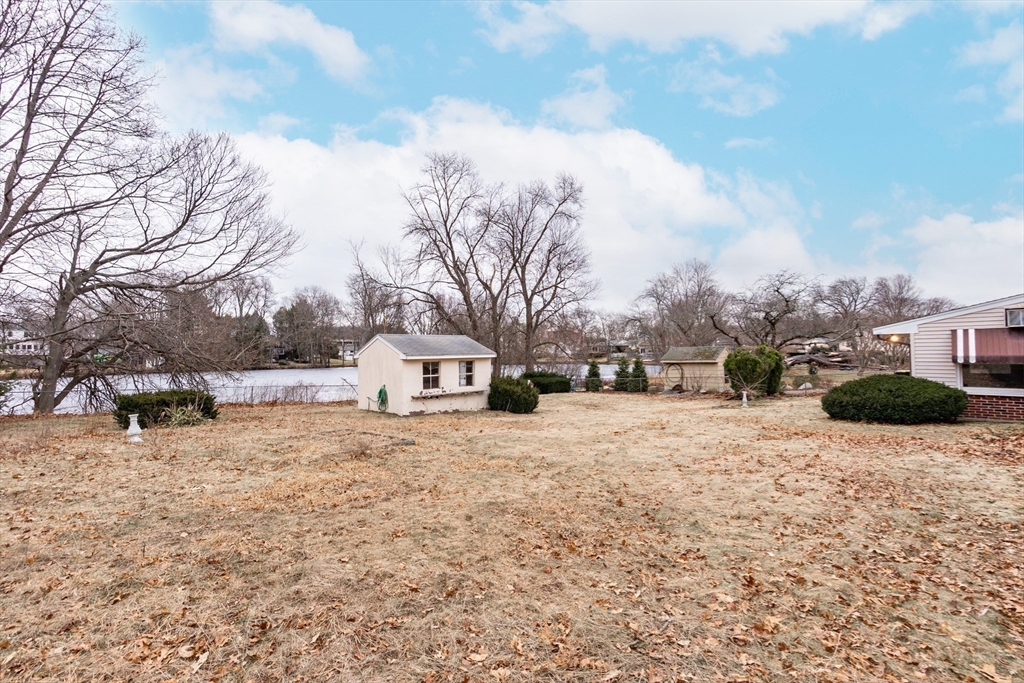 51 Pincushion Road Framingham, MA 01702 - Photo 30 of 42 a street view covered with snow
