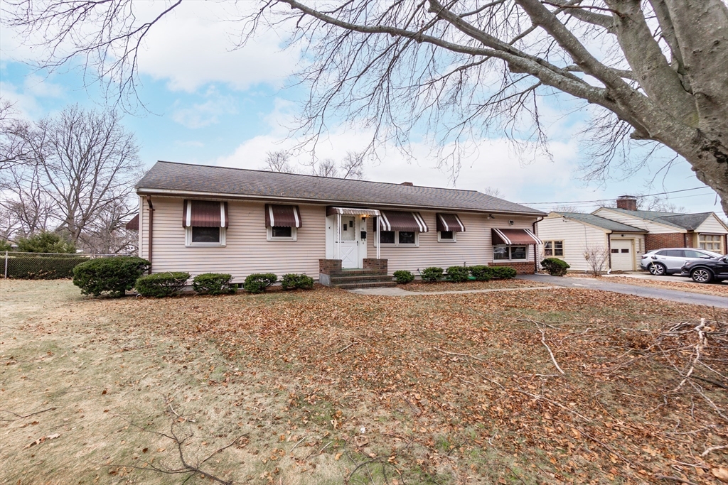 51 Pincushion Road Framingham, MA 01702 - Photo 3 of 42 a front view of a house with a yard