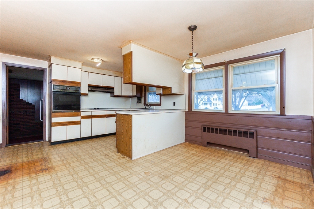 51 Pincushion Road Framingham, MA 01702 - Photo 6 of 42 a kitchen with stainless steel appliances granite countertop a stove a sink and a refrigerator