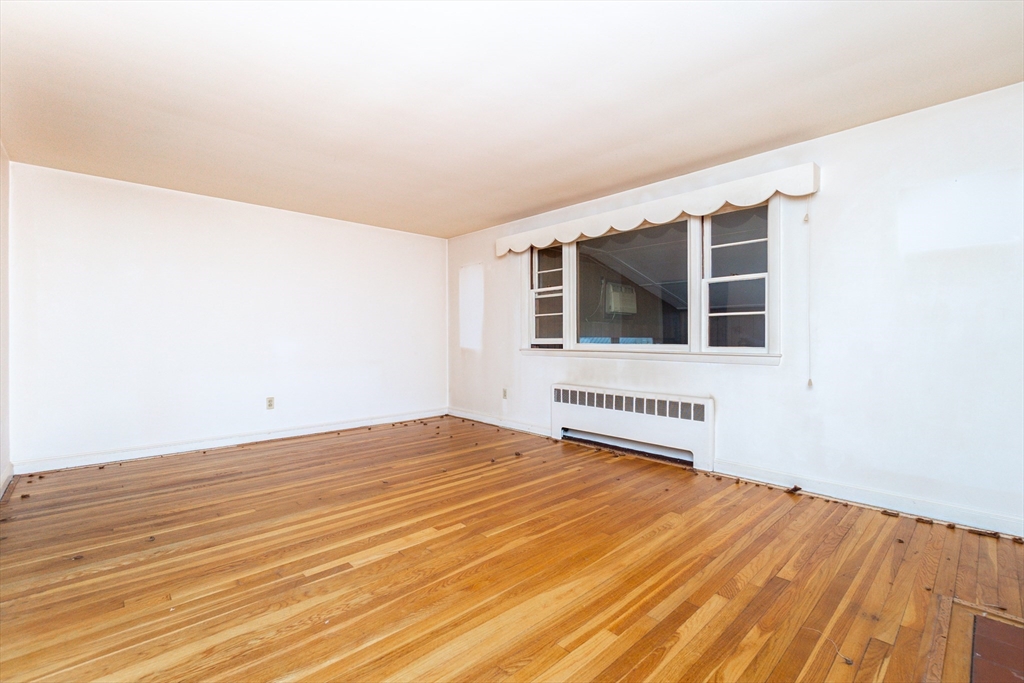 51 Pincushion Road Framingham, MA 01702 - Photo 8 of 42 a view of a bedroom with wooden floor and wooden floor