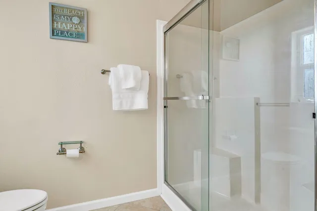 a view of an outdoor dining space with a table and chairs