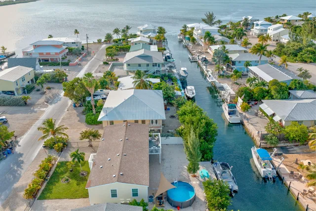 an aerial view of a house with an outdoor space