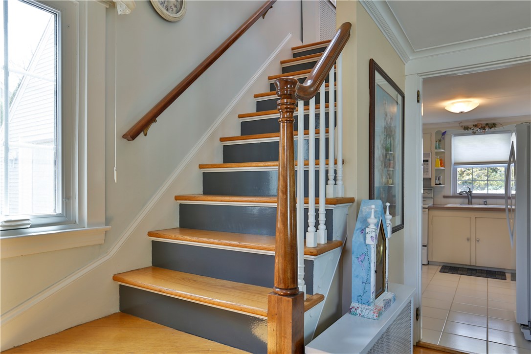 86 St George Court Warwick, RI 02888 - Photo 23 of 39 Stairway to 2nd level / View from Living Room to Kitchen