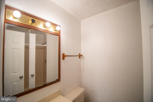 a bathroom with a shower and a mirror