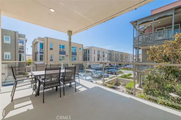a view of swimming pool with outdoor seating and plants
